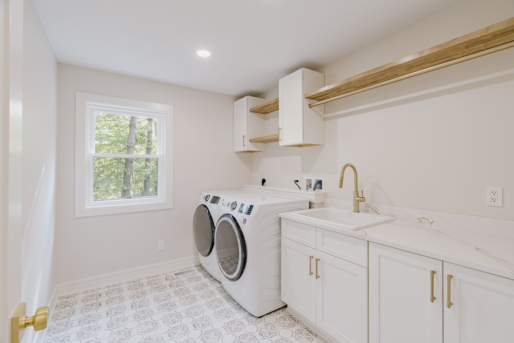 Laundry room with custom cabinetry
