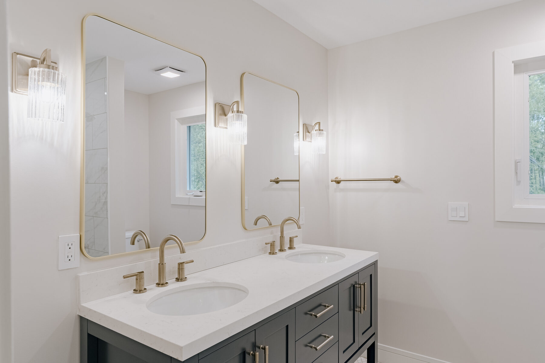 Guest bath with double vanity and brass hardware