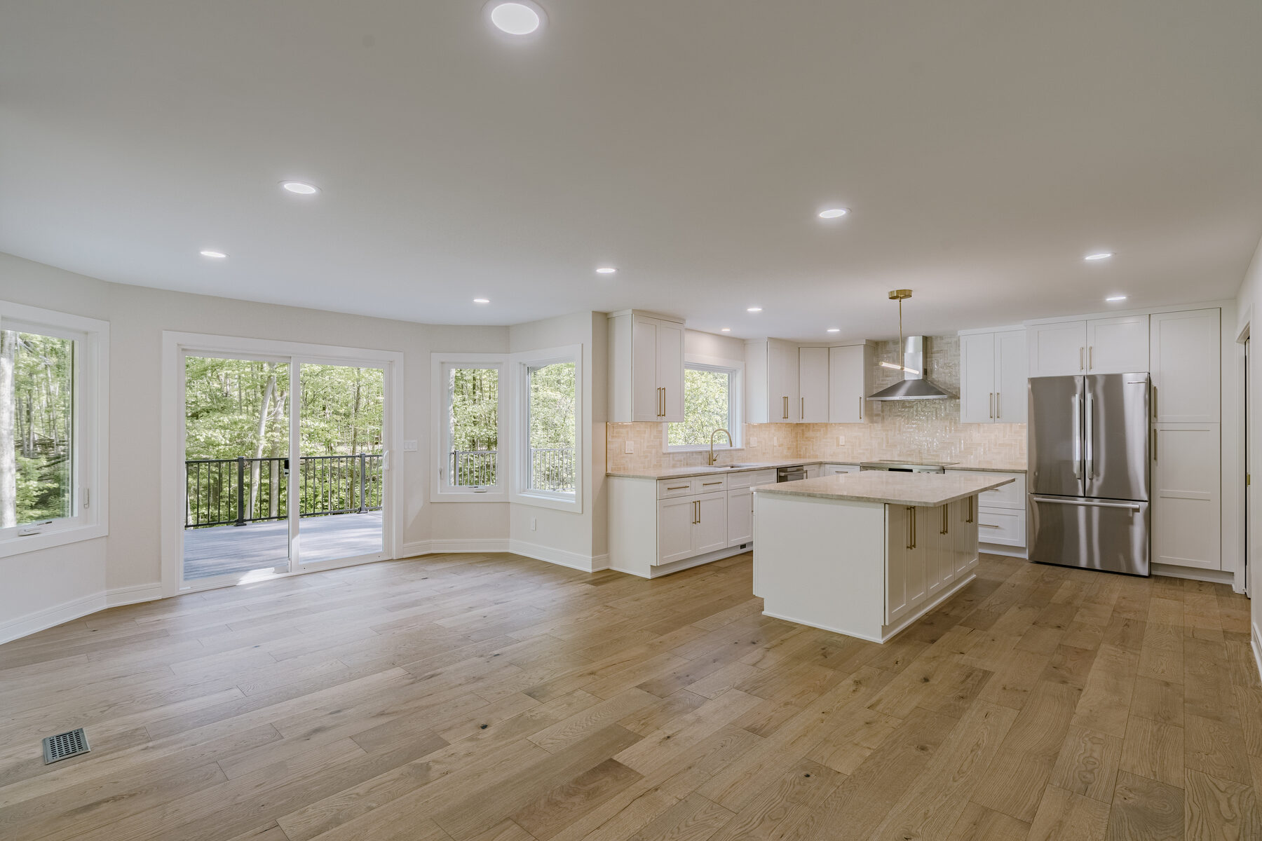 Custom kitchen with quartz island and panoramic windows
