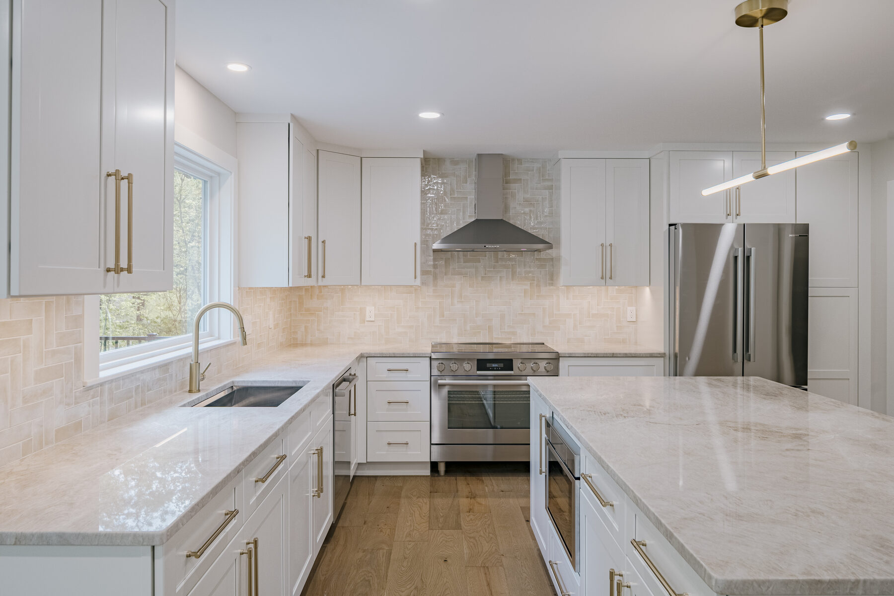 Range, stone backsplash and custom hood